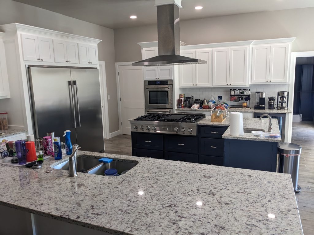 Chef's kitchen with a 48" gas cooktop. The kitchen was designed to minimize the number of steps needed to go from the cooktop to the sink and refrigerator. The space is about efficiency.